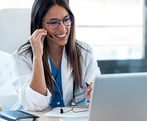 A customer service representative talking into a headset.